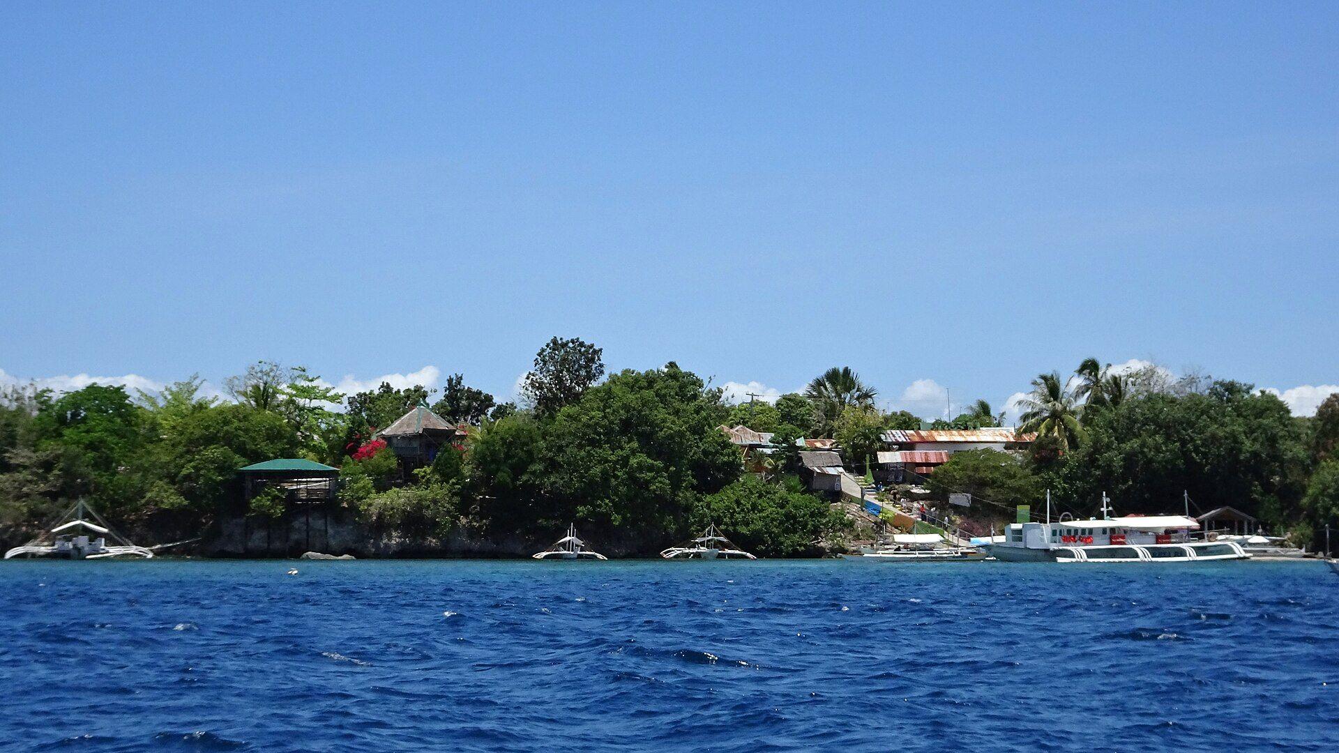 Coastal view of Cabilao Island, Bohol, Philippines, the location of the Talisay Pier dive site