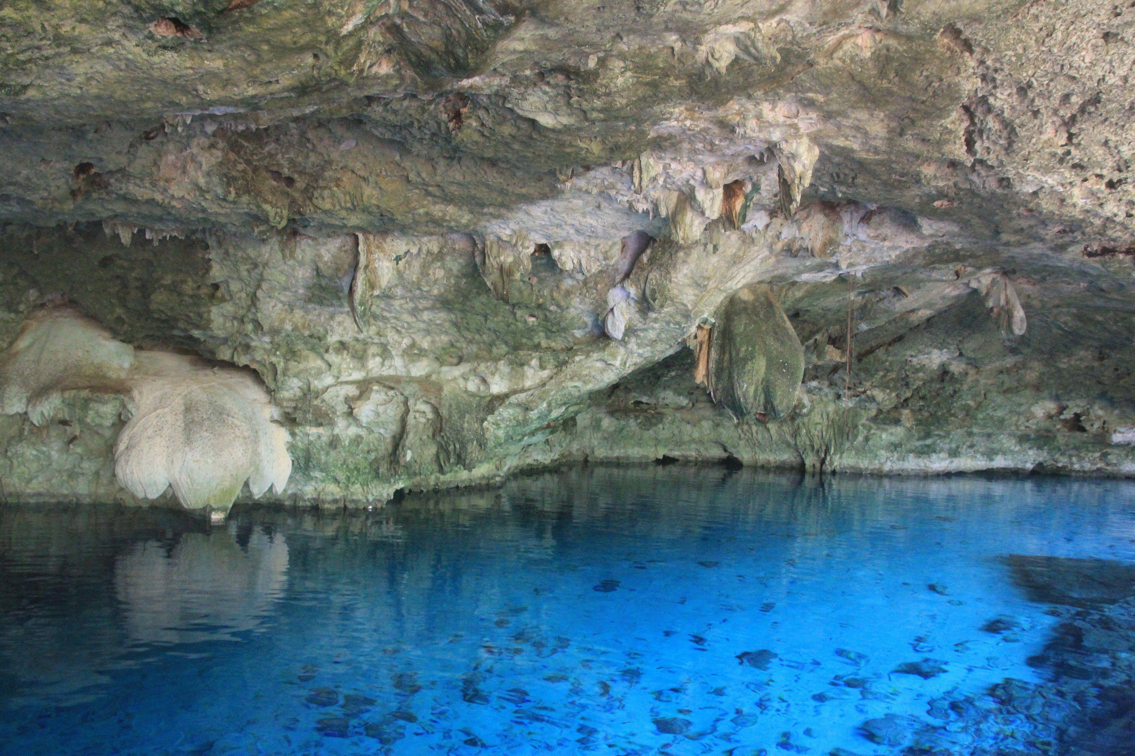 The crystalline cavern pool of Cenote Dos Ojos, Tulum, Mexico.